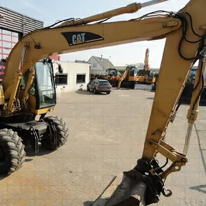 Колесный экскаватор Caterpillar